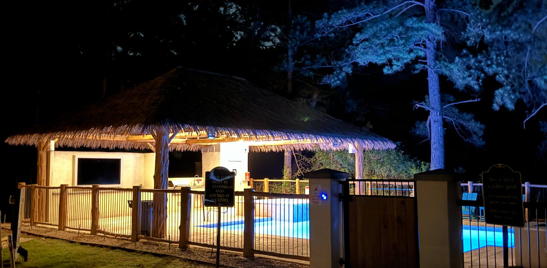 Pool and spa at night at Hidden Lake RV Resort
